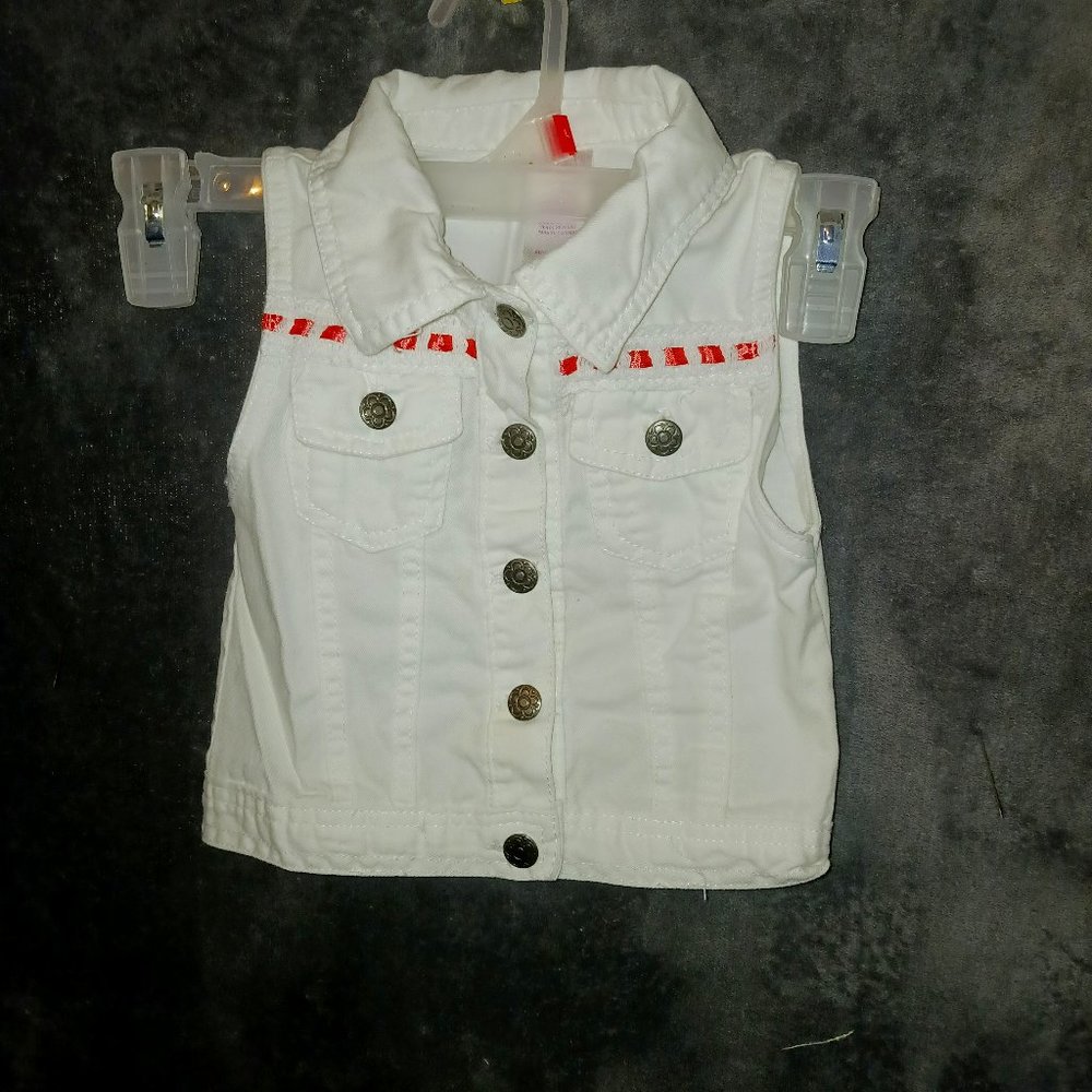 Girl's pretty white vest with pink ribboning